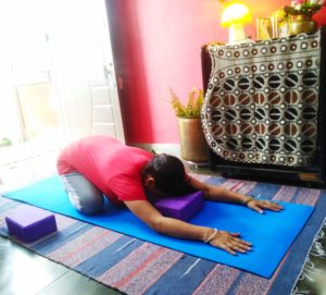 Child's pose with yoga blocks